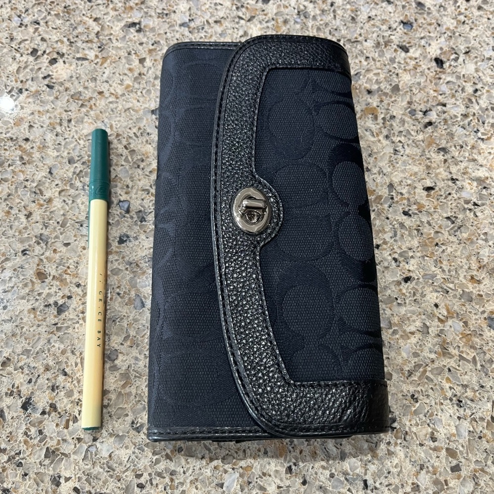 New with tags Coach signature turnkey wallet. Smoke free home.